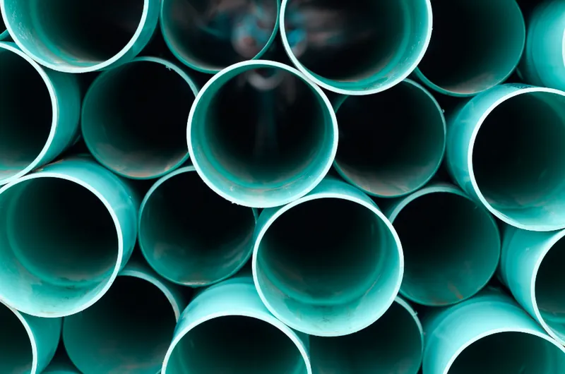 Stack of new PVC water pipes